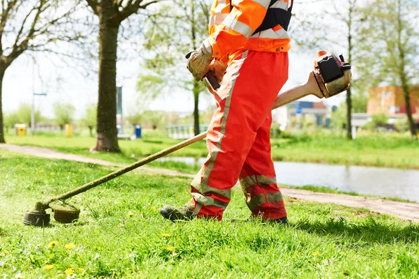 Lawn mower worker man cutting grass