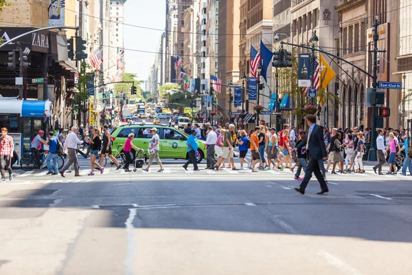 NEW YORK, USA - AUGUST 28, 2014: Crowded 5th Avenue with tourist