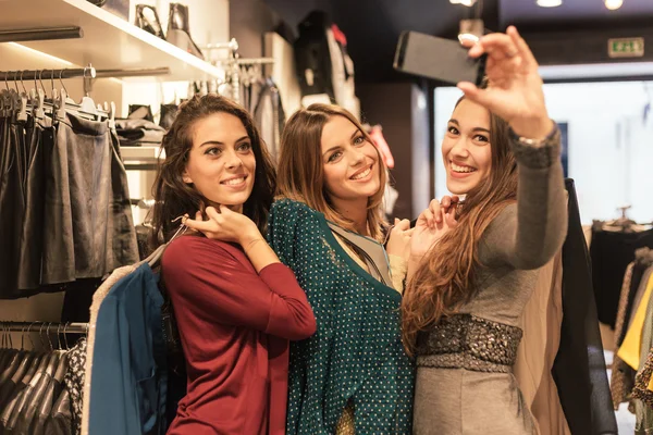 Three women taking a selfie while shopping