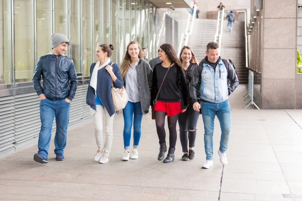 Group of friends walking and having fun together in London