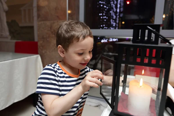 Child looking at candle