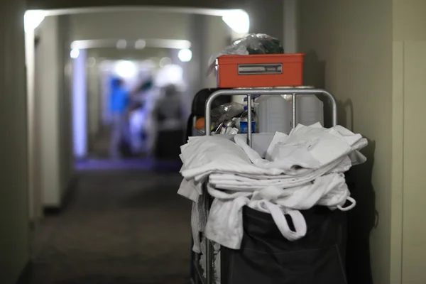 Back of cleaning cart with bedclothes