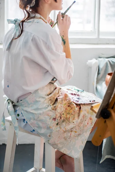 Female painter in her studio