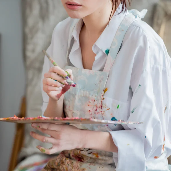 Female painter in her studio