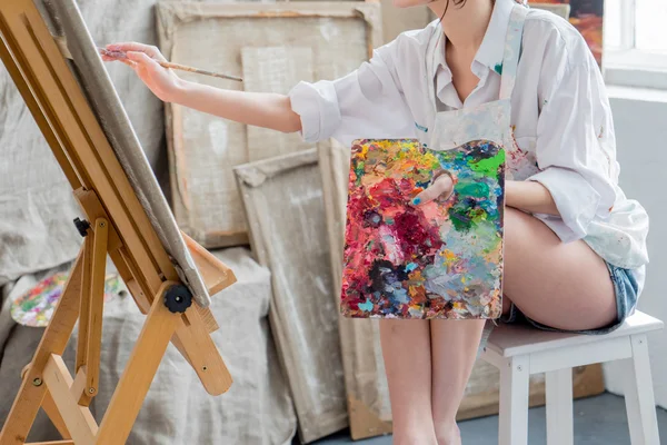 Female painter in her studio