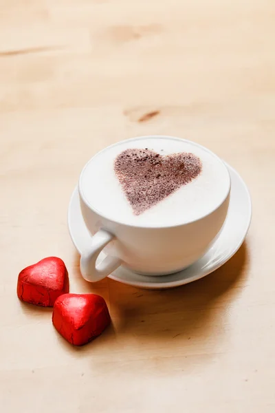 Cappuccino with heart candies