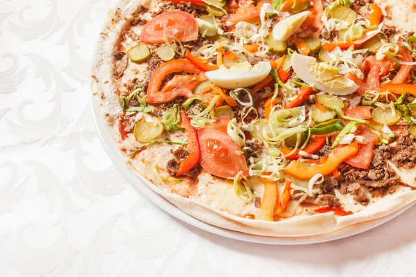 Italian pizza with meat and vegetables