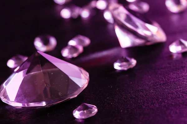 Different diamonds in purple light