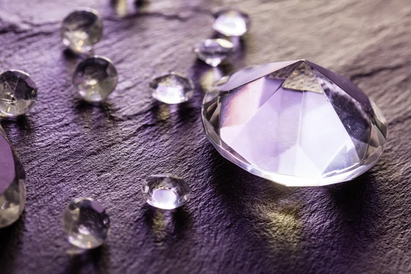 Different diamonds on purple background