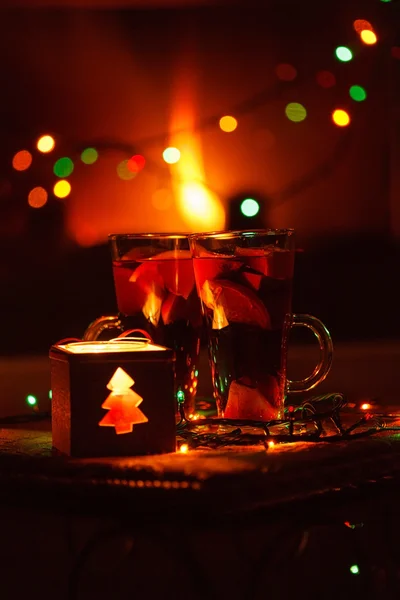 Christmas tea and candle  near chimney