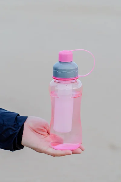 Bottle of water in hand