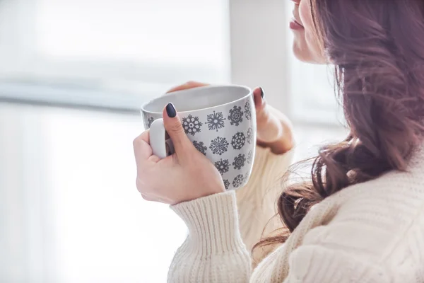 Relaxing woman with cup