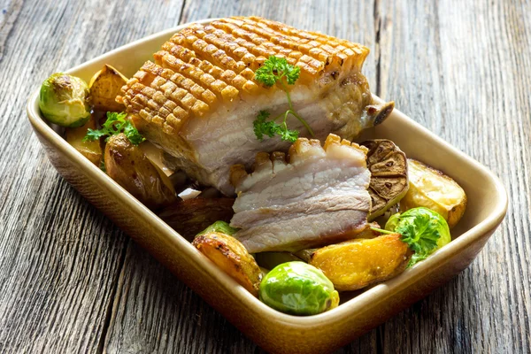 Roasted pork with herbs and vegetables