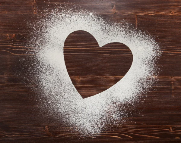 The heart of the flour on the table from the old boards