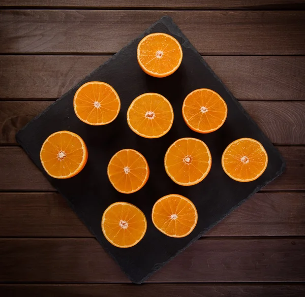 Orange slices on a slate board