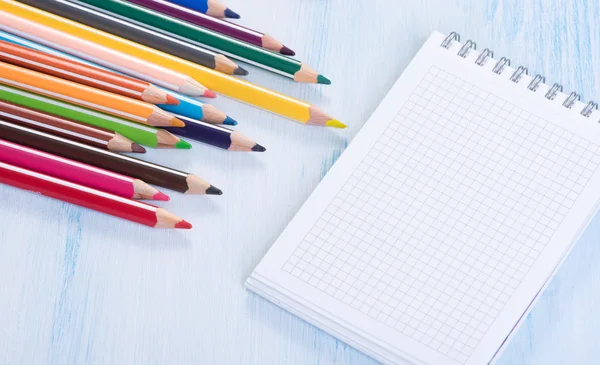 Blank Note Pad and colorful Pencils