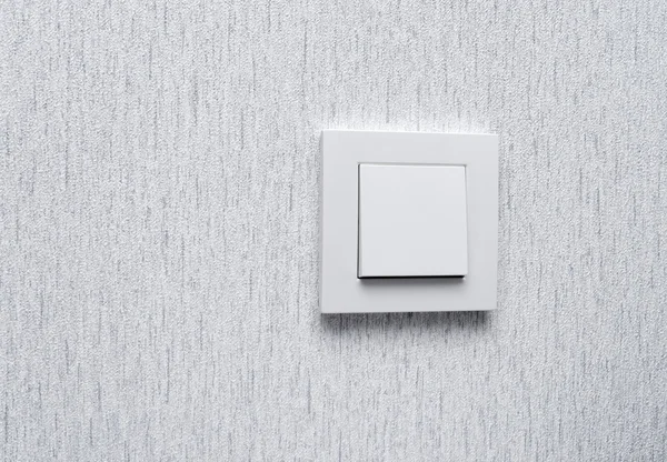 Light switch  White light switch on white wall  Concept  On O
