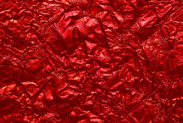 Red shiny wrinkle foil paper as background