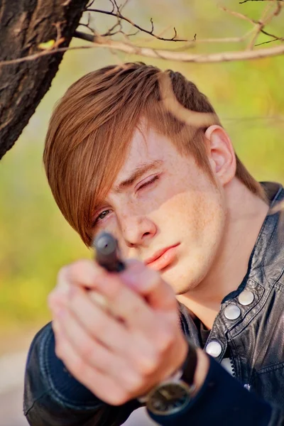 Red-haired guy with gun