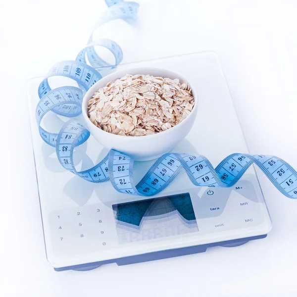 Oat flakes on kitchen scales