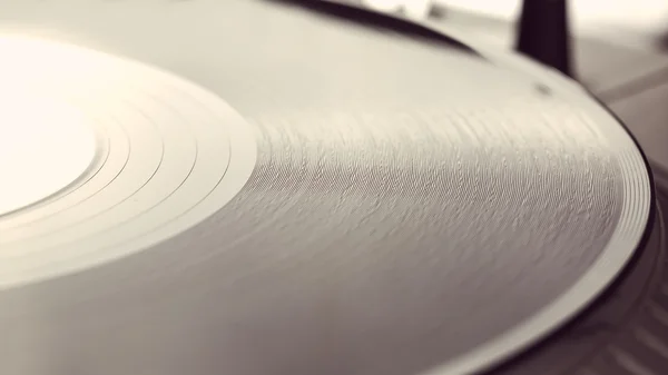 Record on spinning turntable