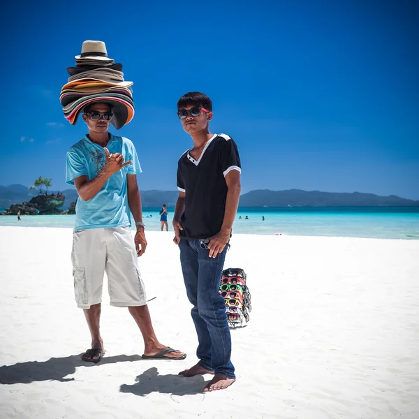 PHILIPPINES, BORACAY ISLAND - 20 MARCH 2013: Beach sellers on co
