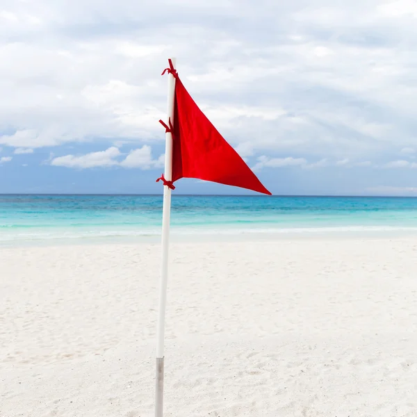 Lifeguard red flag at the beach in bad weather
