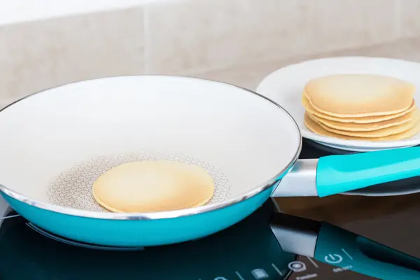 Making home made pancakes on frying pan