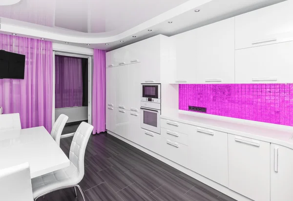 Specious modern white pink interior kitchen-dining room
