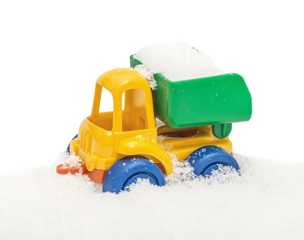 Child\'s toy truck in snow, covered snow