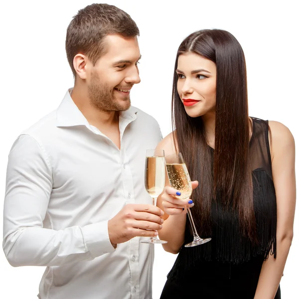 Romantic new years eve fashion couple toasting with champagne.