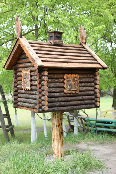 Toy house in the woods . A hut on chicken legs