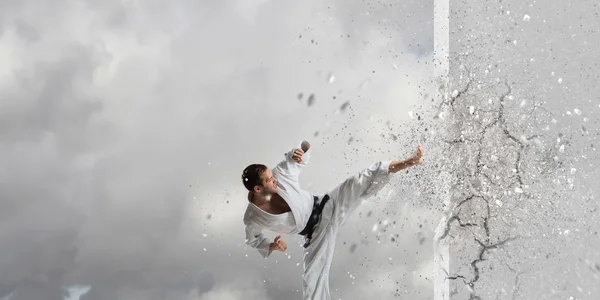 Man in kimono breaking wall