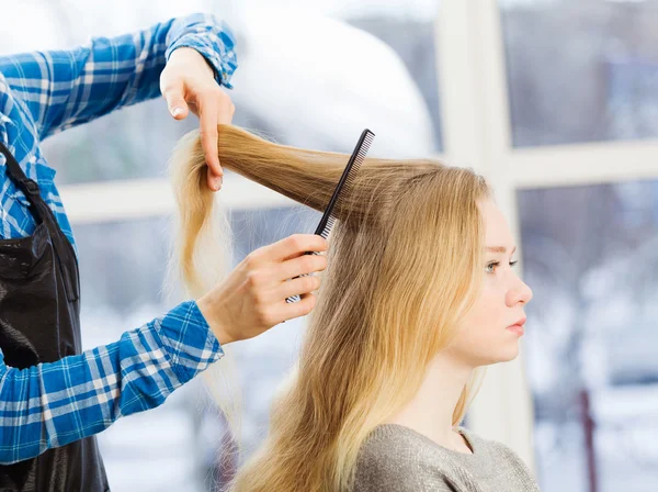 Young woman and hairdresser