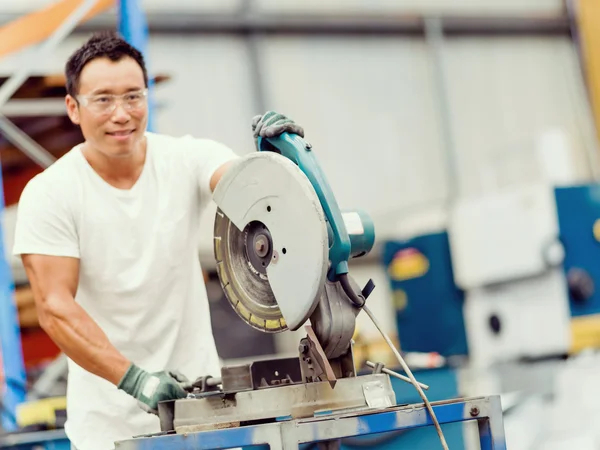 Asian worker in production plant on the factory floor