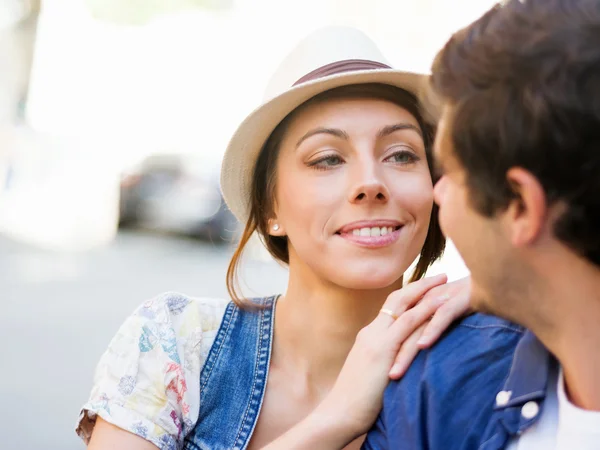 Happy young couple walking in city