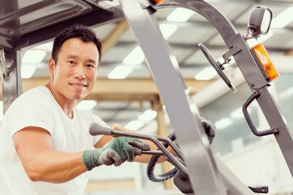 Asian worker in production plant on the factory floor