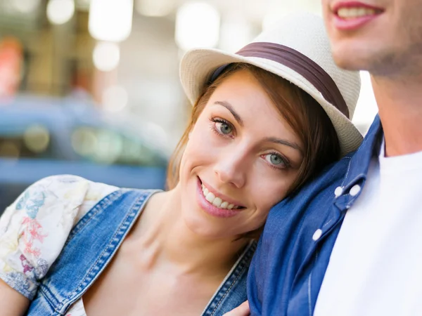 Happy young couple walking in city