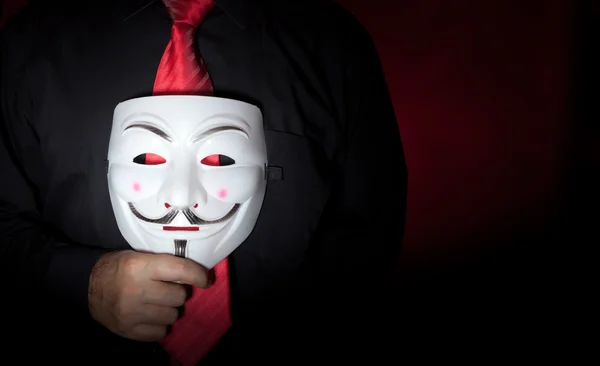 Anonymous mask and red neck tie