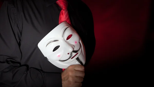 Anonymous mask and red neck tie