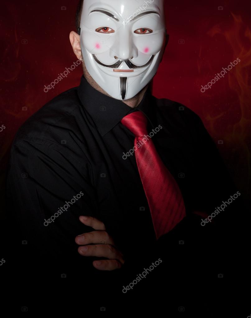 Anonymous mask <b>man hacker</b> in the dark— Photo by namsilat - depositphotos_56476447-Anonymous-mask-man-hacker