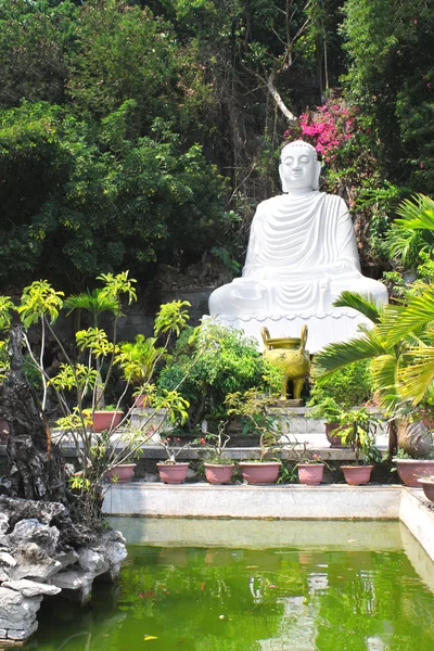 Statue of Buddha near to Pagoda on the marble mountain Da Nang,