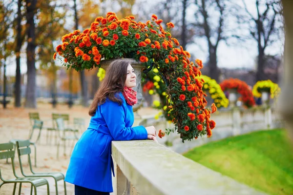 Beautiful young tourist in Paris on a fall day