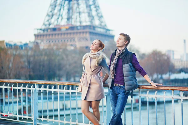 Romantic couple near the Eiffel tower in Paris, France