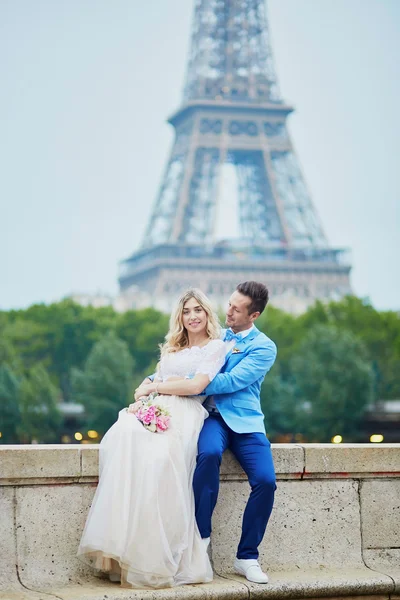 Just married couple near the Eiffel tower in Paris