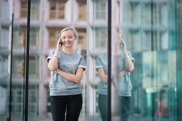 Young business woman speaking on the phone