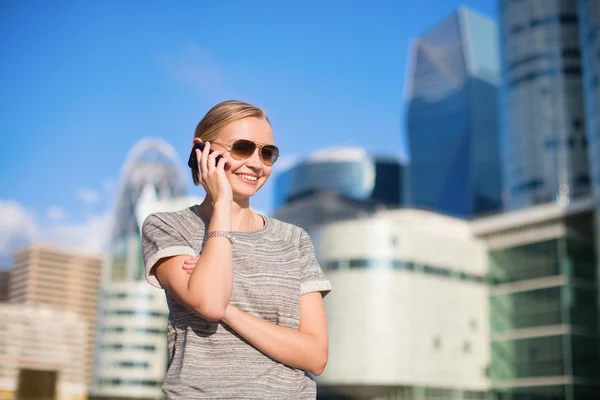 Young business woman speaking on the phone