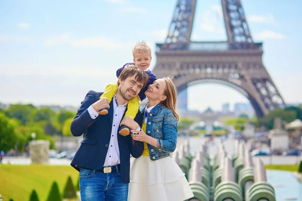 Happy family of three in Paris
