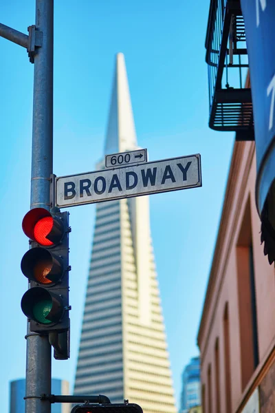 Red traffic light and Broadway street sign in San Francisco