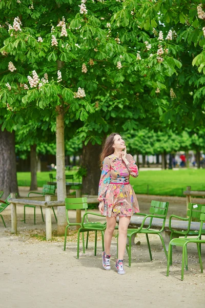 Beautiful young woman in the Tuileries garden in Paris
